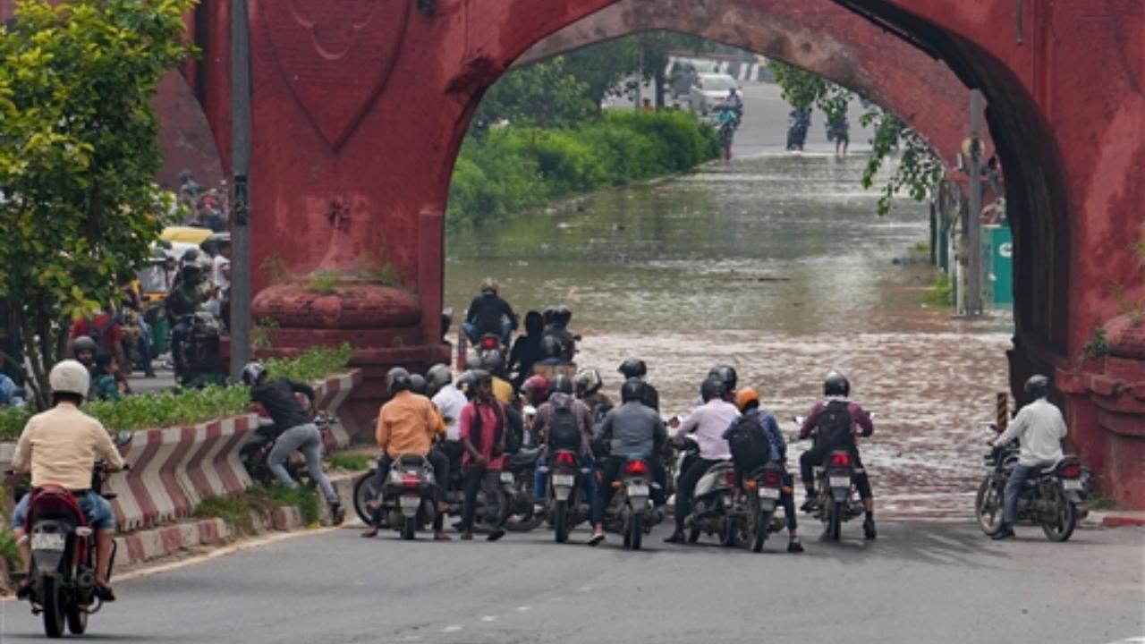 After breaching the danger mark on Monday, waters from the raging Yamuna spilled onto the roads of the national capital, inundating several areas
 