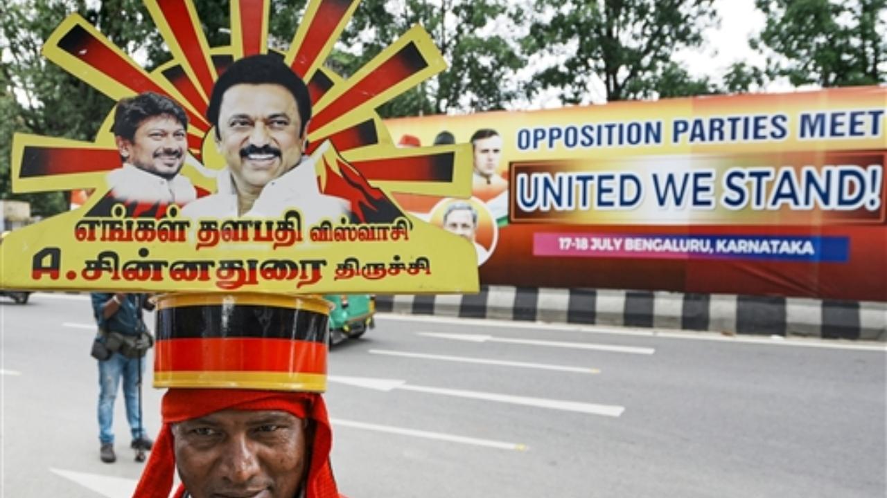 They said that since leaders of 26 opposition parties cannot hold meetings in a short period, there is a proposal to form a group for coordination
In Pic: A Dravida Munnetra Kazhagam (DMK) supporter outside the venue of the united opposition meeting
 