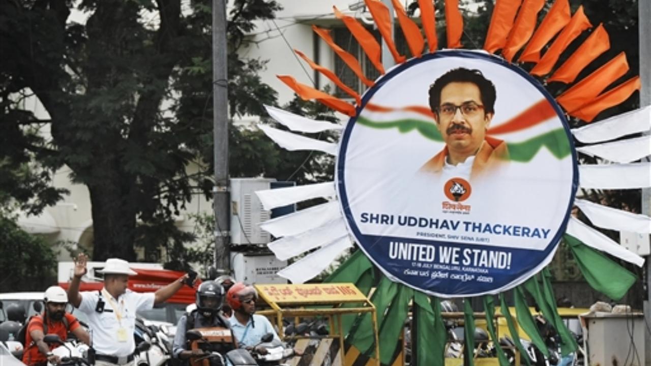 There is a suggestion that a group should be formed to decide on issues to be raised collectively against the Narendra Modi government
In Pic: A poster of Shiv Sena (UBT) chief Uddhav Thackeray put up near the venue of the united opposition meeting
 