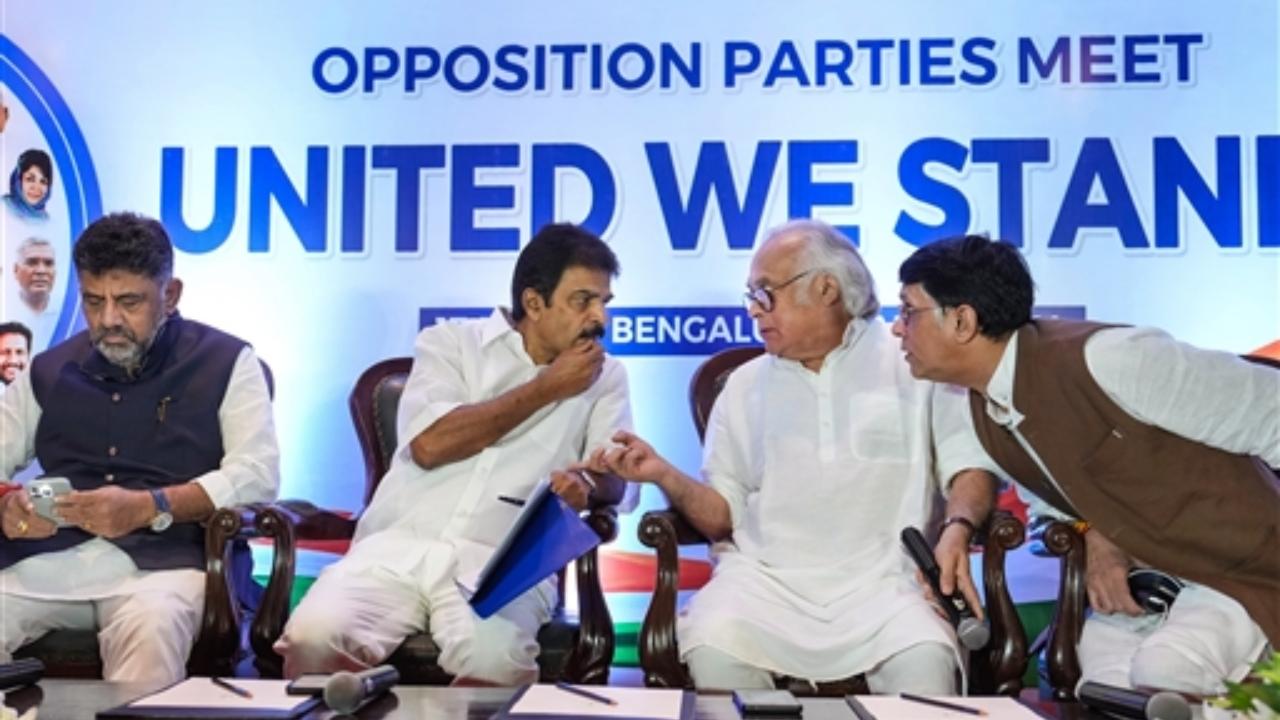 Congress leader KC Venugopal interacts with party leaders Jairam Ramesh and Pawan Khera during a press conference ahead of the united opposition meeting, in Bengaluru
 