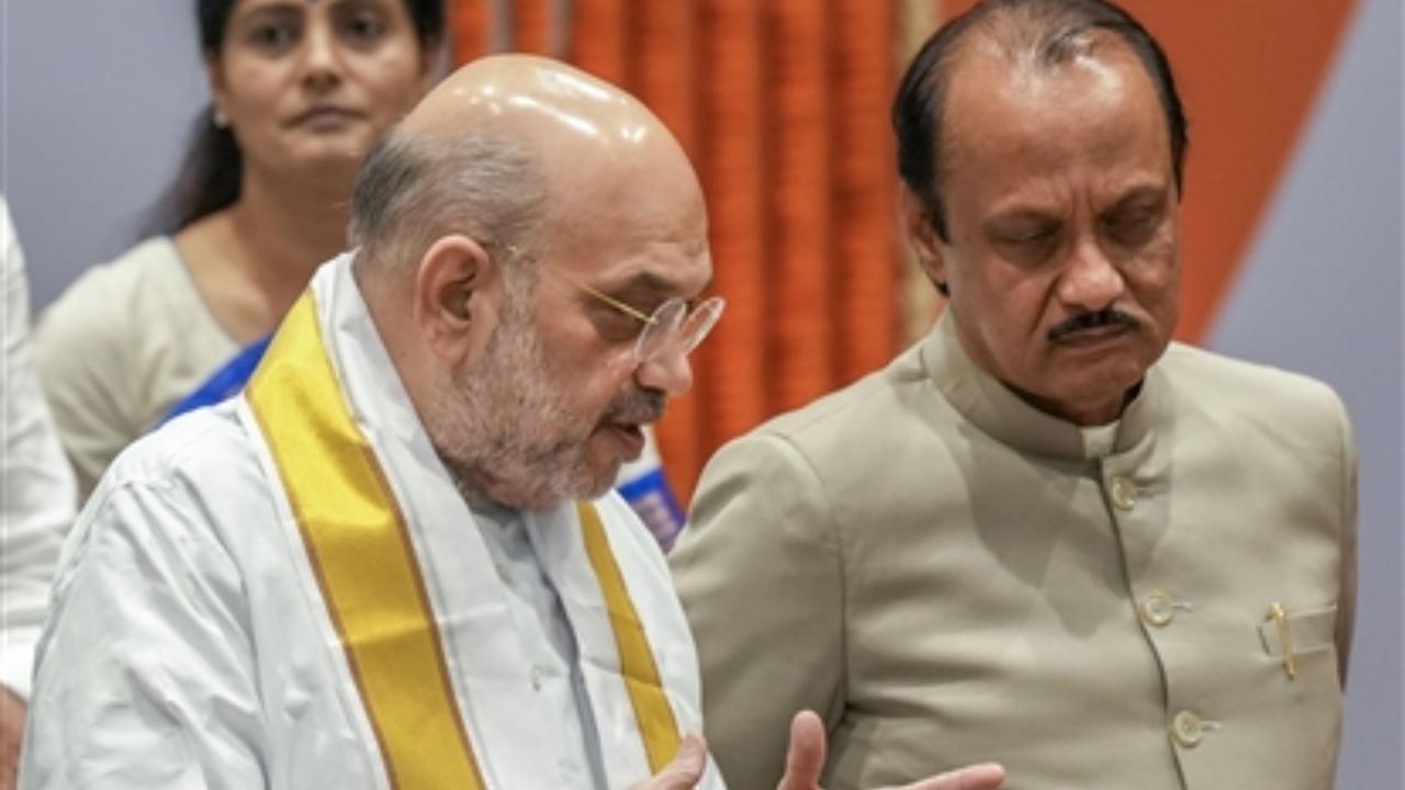 The Bharatiya Janata Party is holding a meeting of 38 parties of the National Democratic Alliance (NDA) in the national capital on Tuesday
In Pic: Union Home Minister Amit Shah and Maharashtra Dy CM Ajit Pawar during the National Democratic Alliance (NDA) meeting ahead of Lok Sabha elections
 
