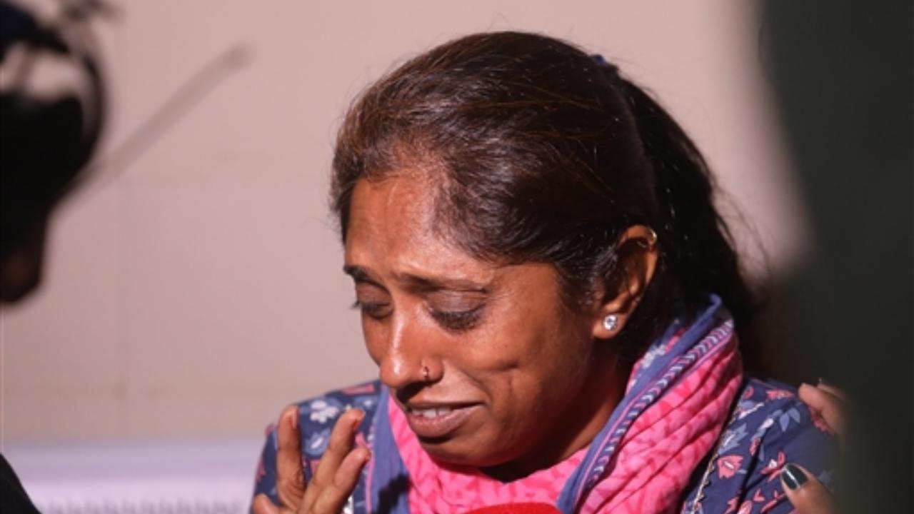 A relative reacts as she speaks with the media at a hospital after a speeding luxury car ploughed into a crowd at an accident site on a flyover, in Ahmedabad
 