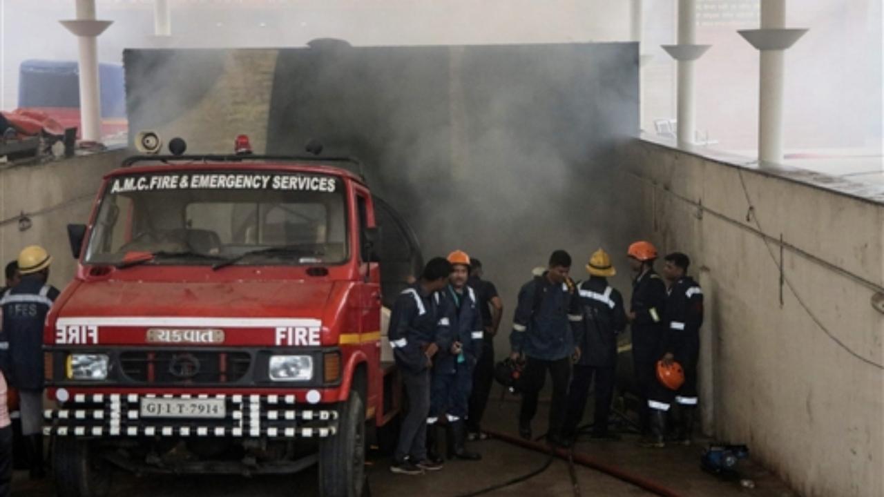 Firefighters at the spot after a fire broke out in the basement of a hospital, in Ahmedabad
 