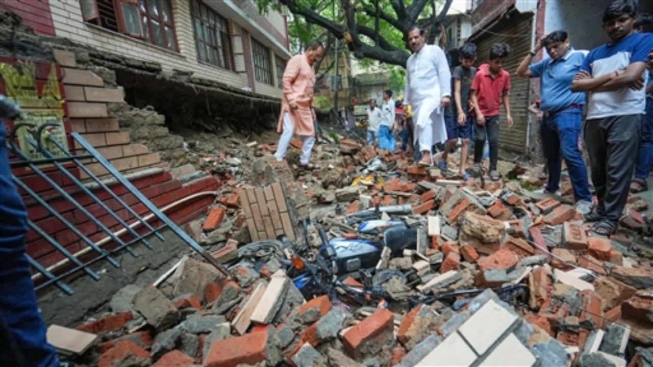 Delhi BJP President Virendra Sachdeva visits the site after a wall of a government school collapsed following monsoon rains, at Garhi Jharia Maria in East of Kailash, in New Delhi
 