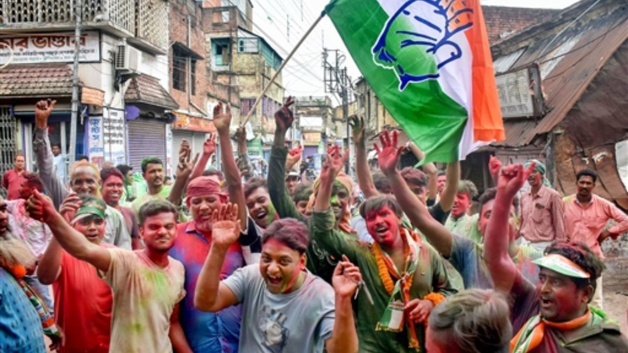Congress workers celebrate the party’s lead during the counting of votes of West Bengal panchayat polls, in Murshidabad district
 