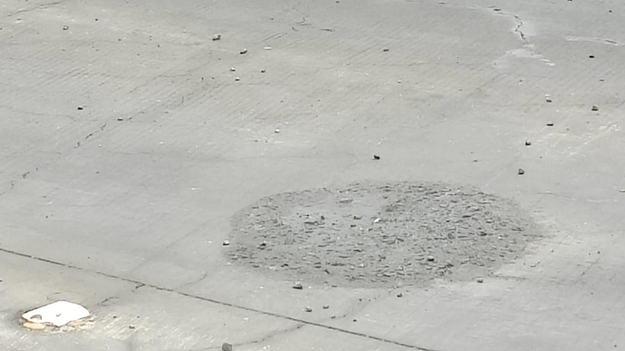 When the mid-day photojournalist on Monday visited the bridge to take photos of the damaged surface towards Thane, a person at the site tried to stop him even as workers were repairing the damage. Commuters have questioned the quality of the construction.