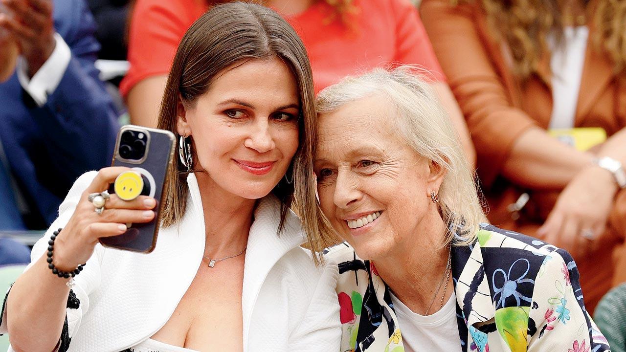 Martina Navratilova (right) and wife Julia Lemigova pose for a selfie in the Royal Box at Wimbledon. Navratilova is a nine-time singles champ