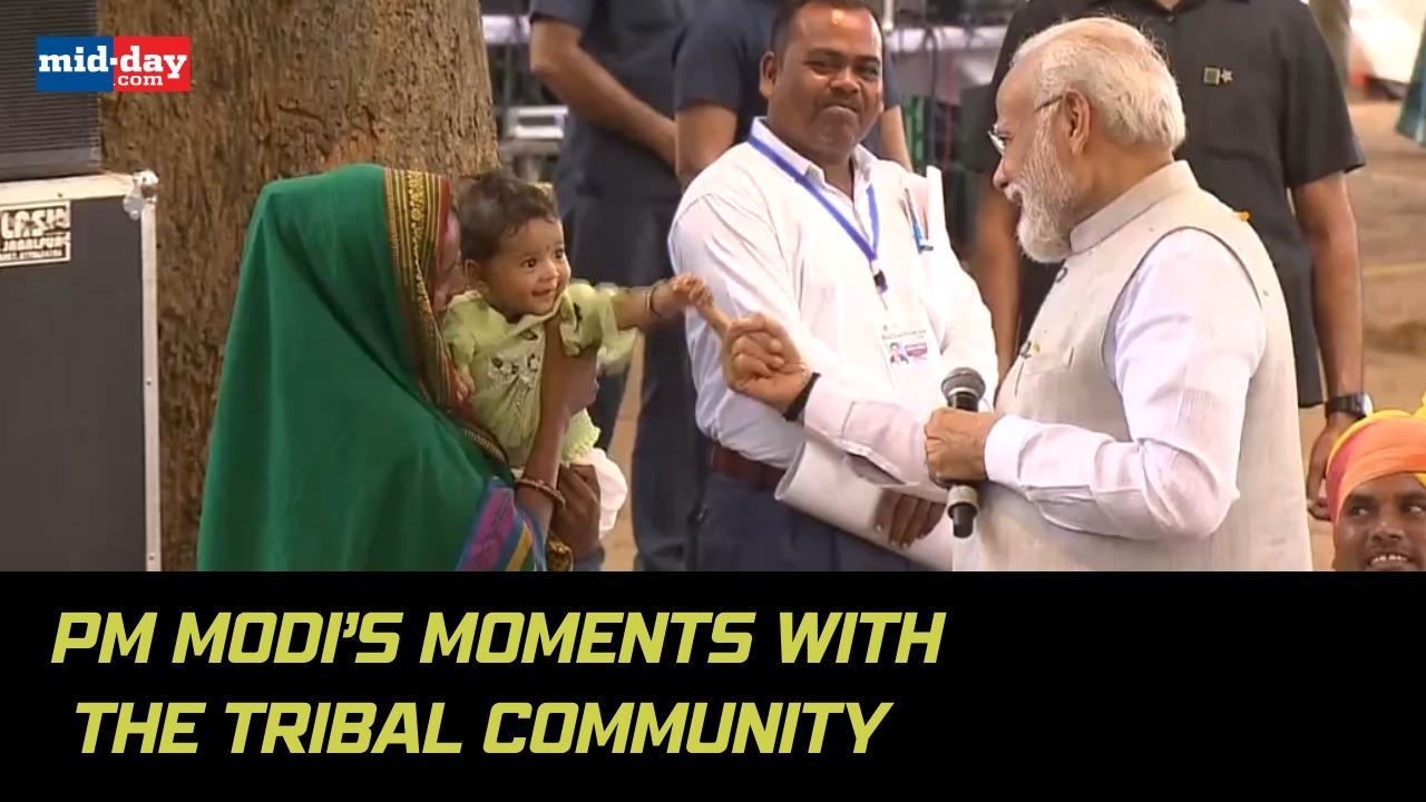 Prime Minister Narendra Modi interacts with tribal community leaders