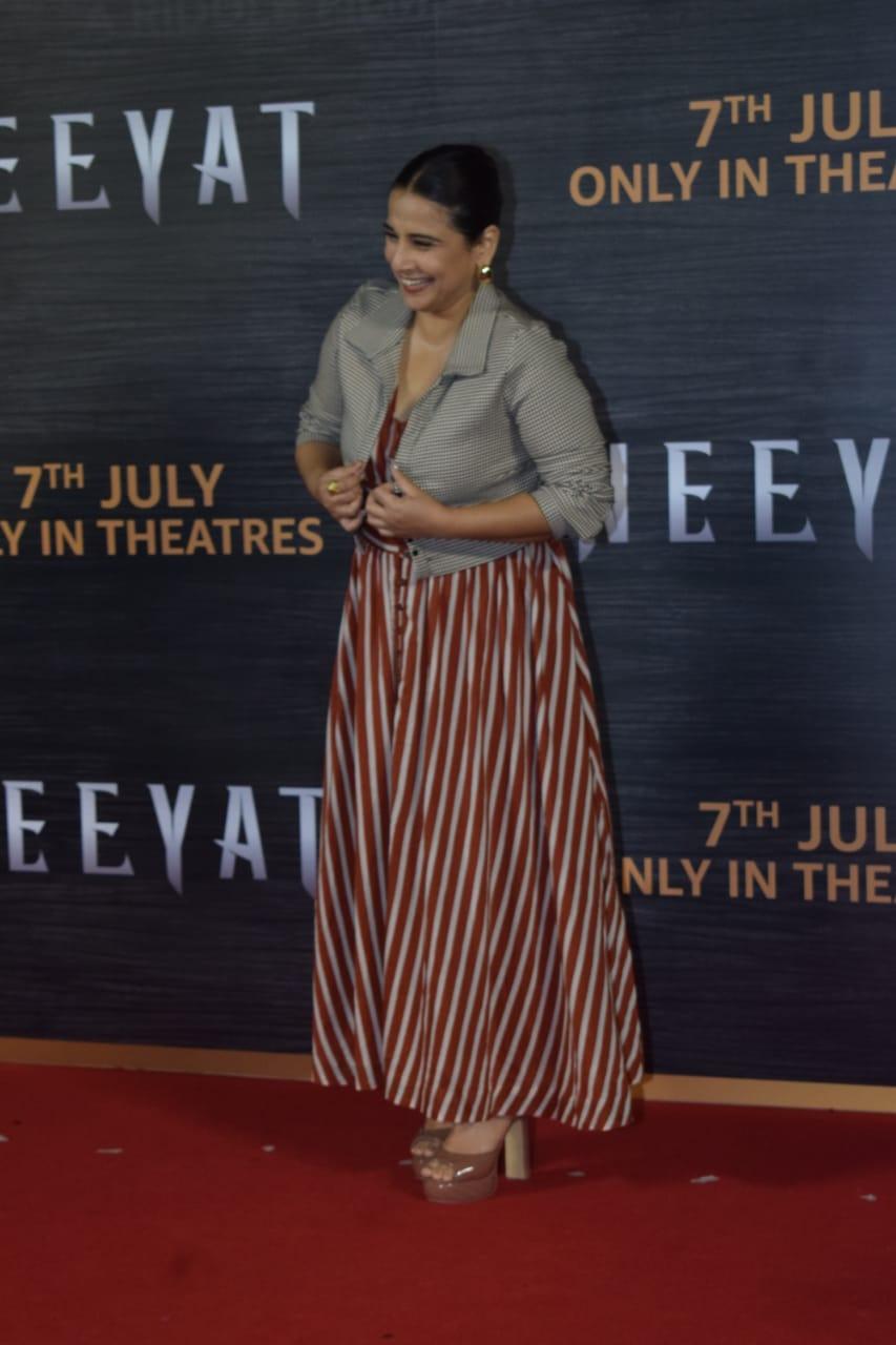 Vidya Balan opts for a red and white striped gown paired with a jacket