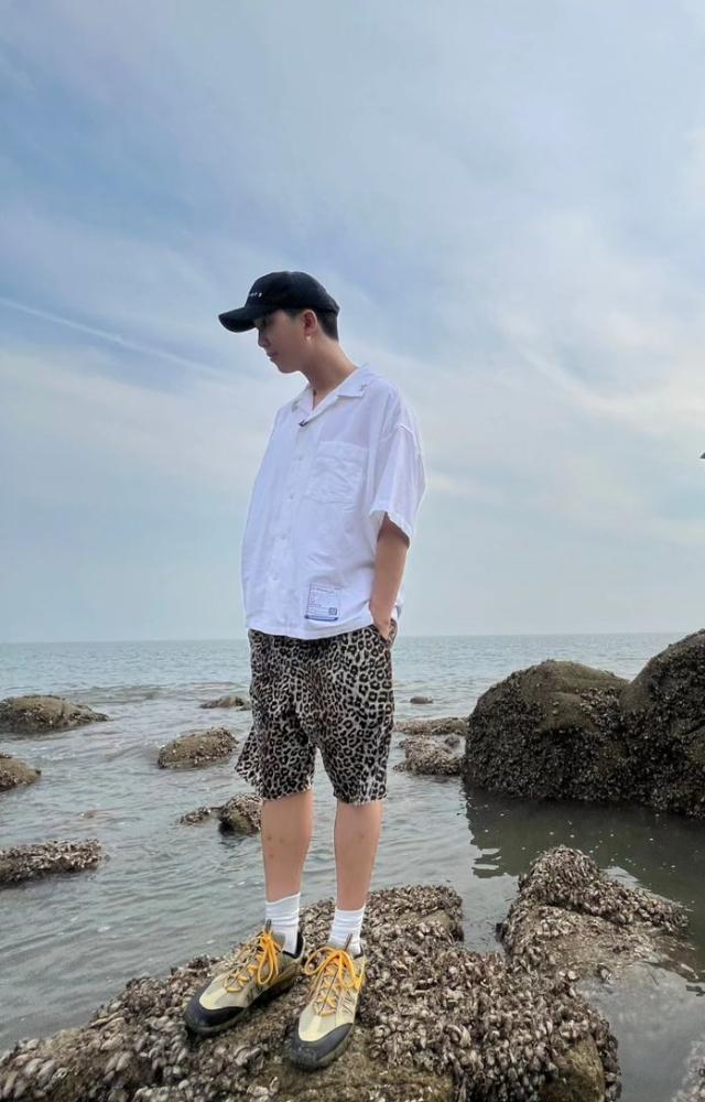Another masterpiece in motion - Namjoon is lost in thought as he gazes at the rocks (searching for crabs perhaps?)