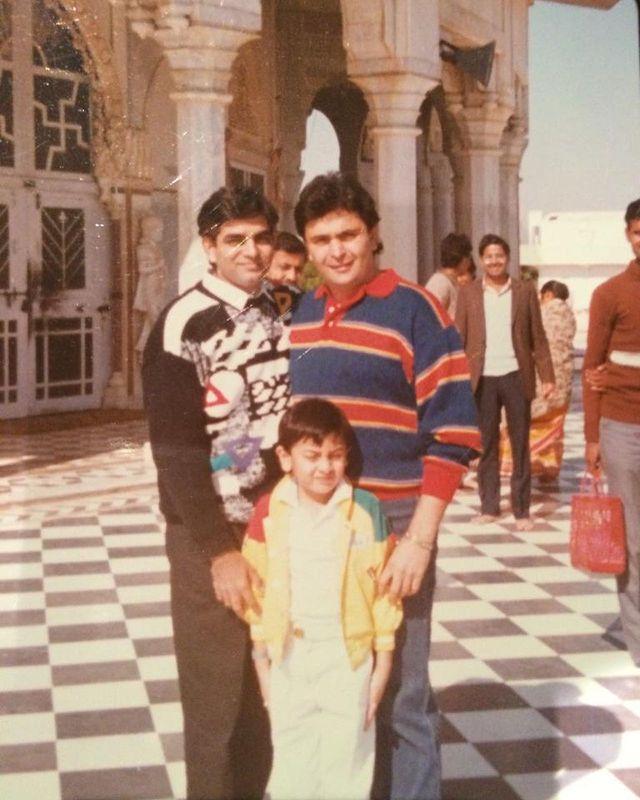 This old picture shows a young Ranbir Kapoor posing with Rishi Kapoor and Raj Bansal in front of a temple