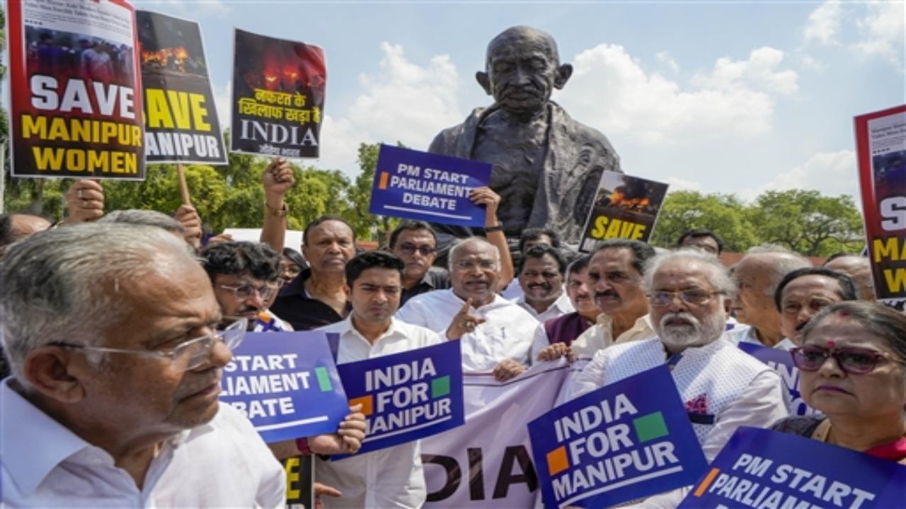 Holding placards and banners that read 