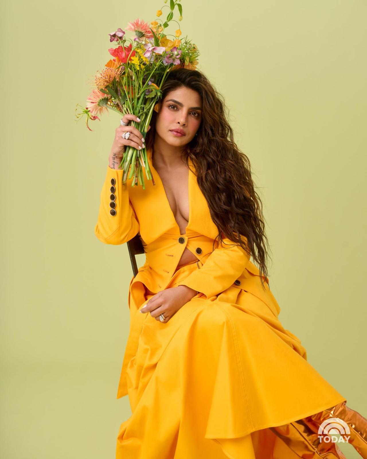 Priyanka Chopra looked stunning in a deep neck two-piece yellow dress. Priyanka Chopra, who knows how to ace the fashion game, makes a remarkable style statement with soft curls and nude makeup. With only a few rings, the actress kept her accessories simple