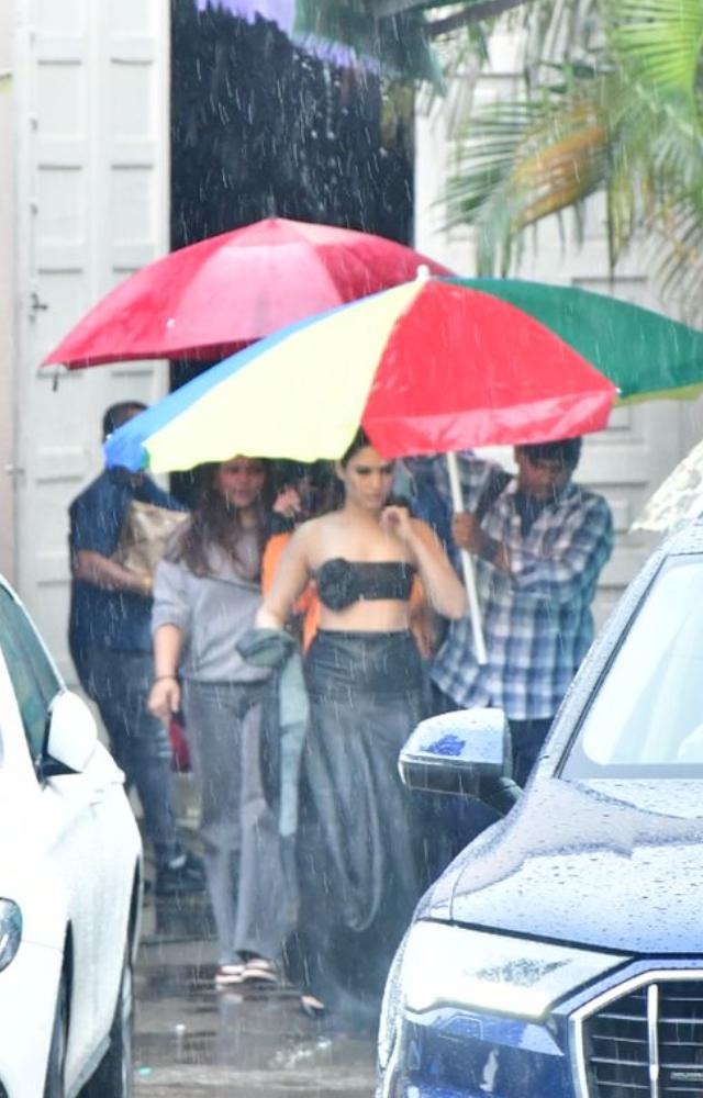 Dressed in a black costume, Tamannaah was seen heading to her car post shoot with the help of her team
