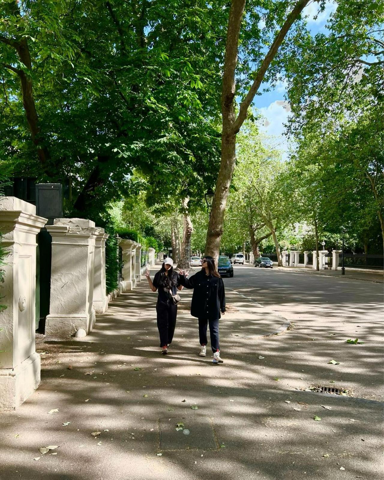 Sisters' day out - Sonam and Rhea enjoy a leisurely walk through the sun-dappled streets of London. Judging by their animated gestures, they have much to catch up on!