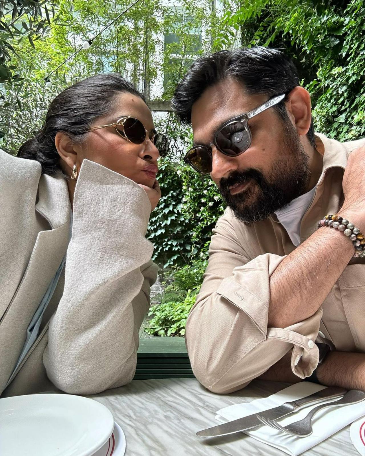 Rhea also shared a picture of herself goofing around with Karan. The couple seem to be passing time making mem-worthy jokes as they wait for their food to arrive