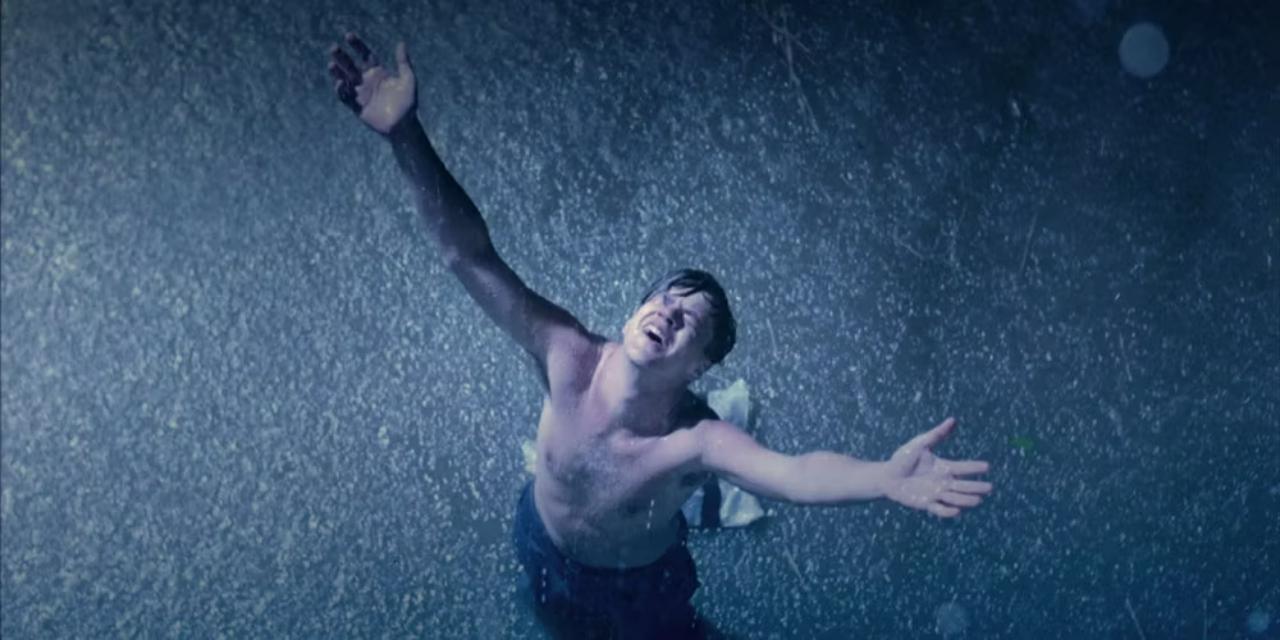 The Shawshank Redemption
When Andy Dufresne (Tim Robbins) finally escapes Shawshank Prison, he steps into a heavy downpour. With arms raised, he embraces the rain, creating an iconic cinematic scene symbolizing his liberation. No more words need to be said!
