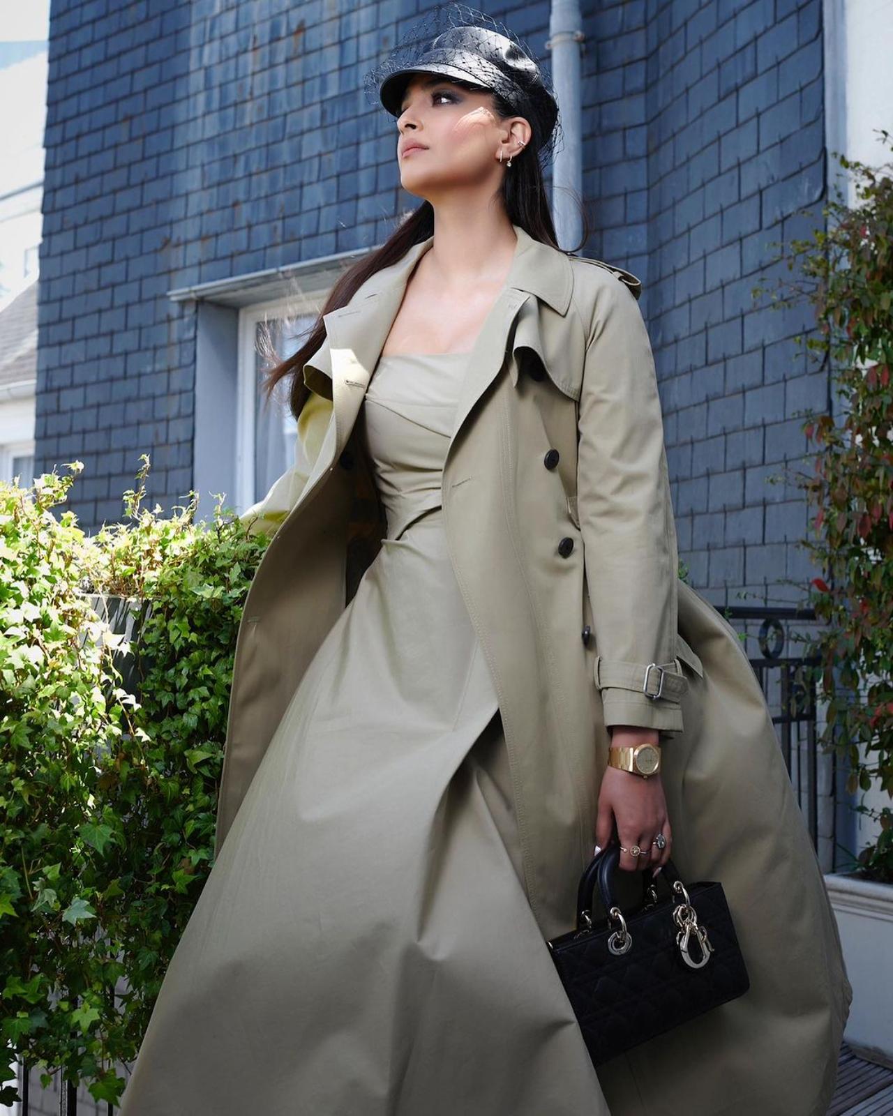 The actress completed the look with bold smoky eye shadow, glossy mauve lip shade, kohl-lined eyes, mascara on the lashes, darkened brows, rouged cheekbones, and a light contoured dewy base