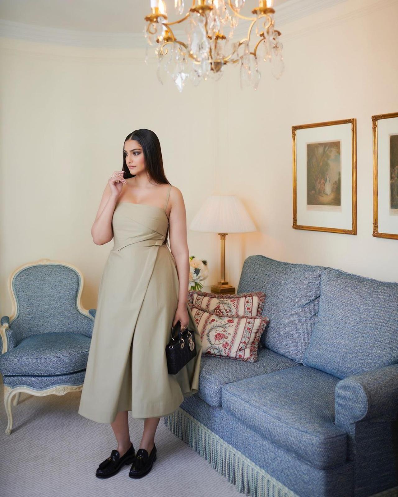 Sonam Kapoor also shared pictures without the coat and looked equally stunning in the biege strap-sleeve dress