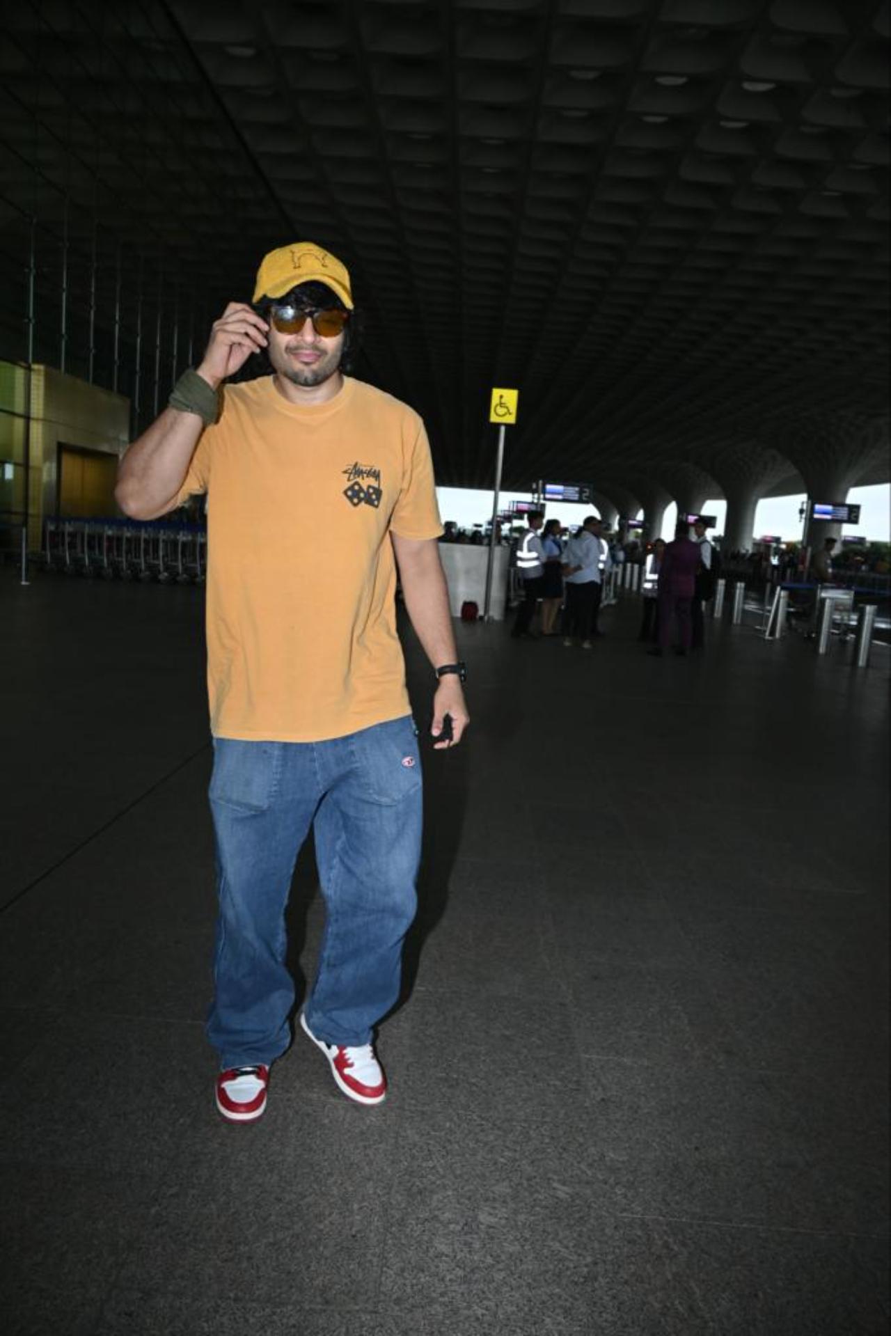 Ali Fazal was spotted at the airport. The actor was wearing an orange t-shirt and blue denim 