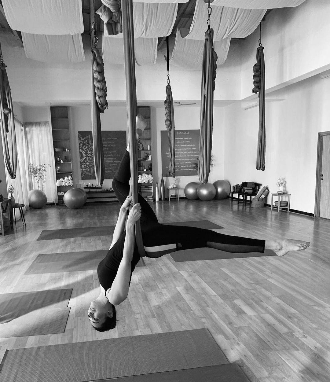 Kareena's sister Karisma Kapoor posted a black and white photo of herself doing aerial yoga. 