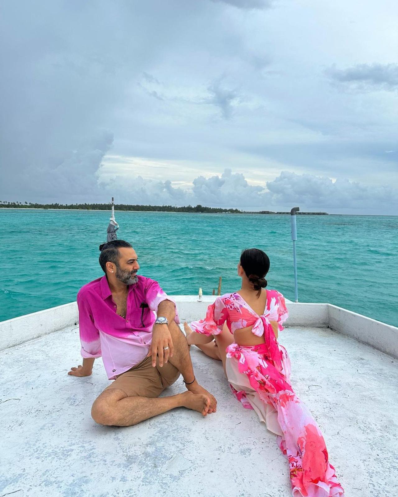 Sonnalli also included pictures with her husband Ashesh. Here, he gazes at her on their cruise while she looks out to sea. The back cut-outs on the dress are also visible in this angle
