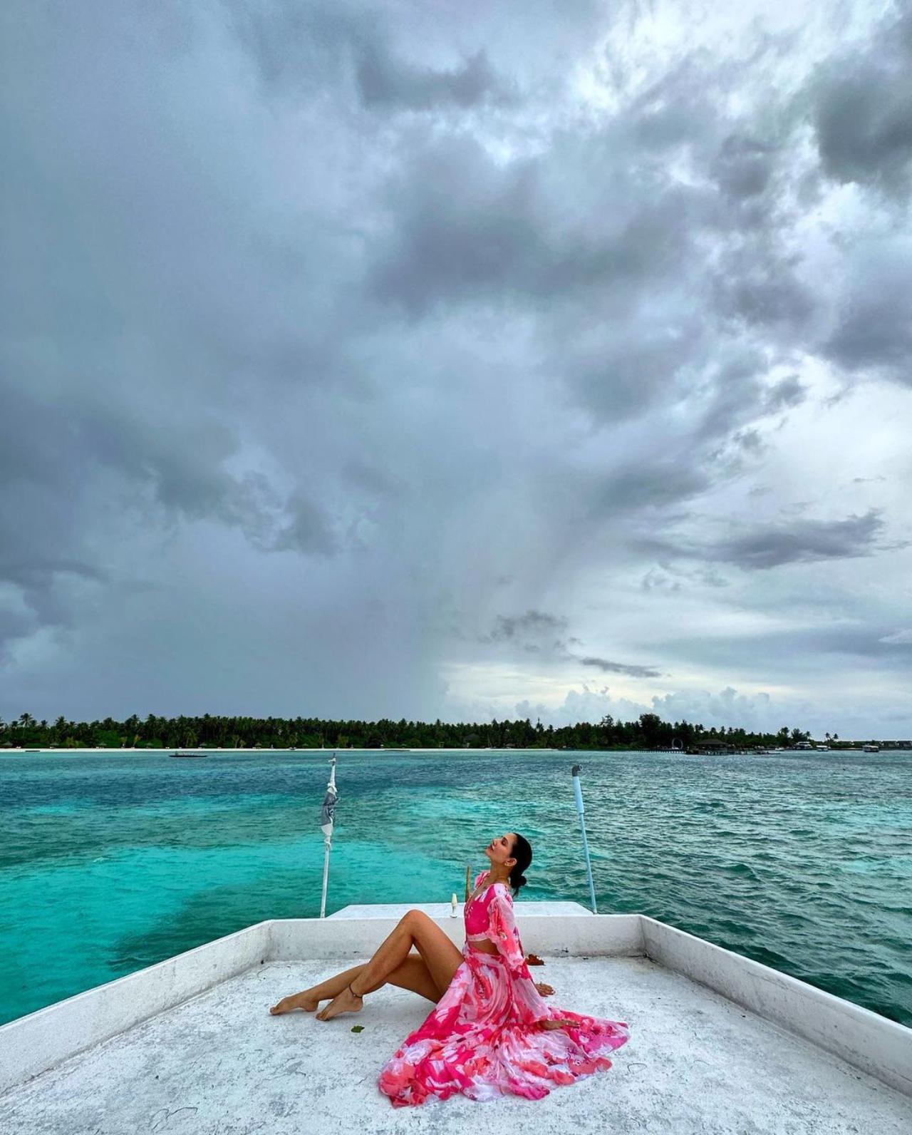 She captioned her photos, “Sunset cruise at @atmospherekanifushi spotting dolphins.” Squint and see if you can spot a dolphin fin in the background!