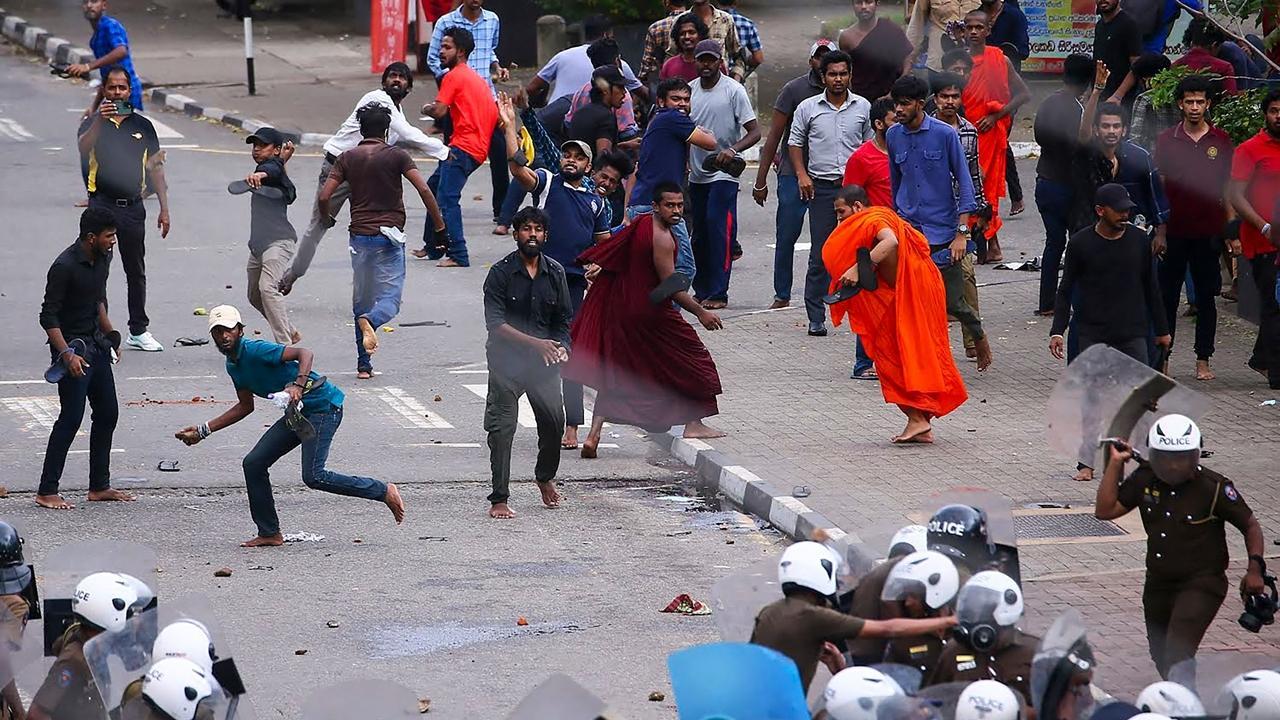 Police and anti-government demonstrators and university students clash during a protest demanding the release of student leaders and against the privatization of education and health, in Colombo on June 7, 2023.
