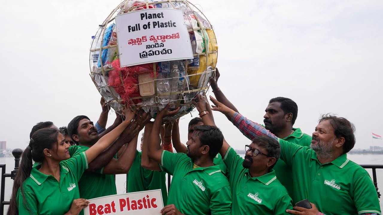 Members of a non-governmental organization display a model of a globe filled with plastic during a demonstration to create awareness on plastic pollution on the eve of World Environment Day in Hyderabad, India, Sunday, June 4, 2023. Pic/AP/PTI