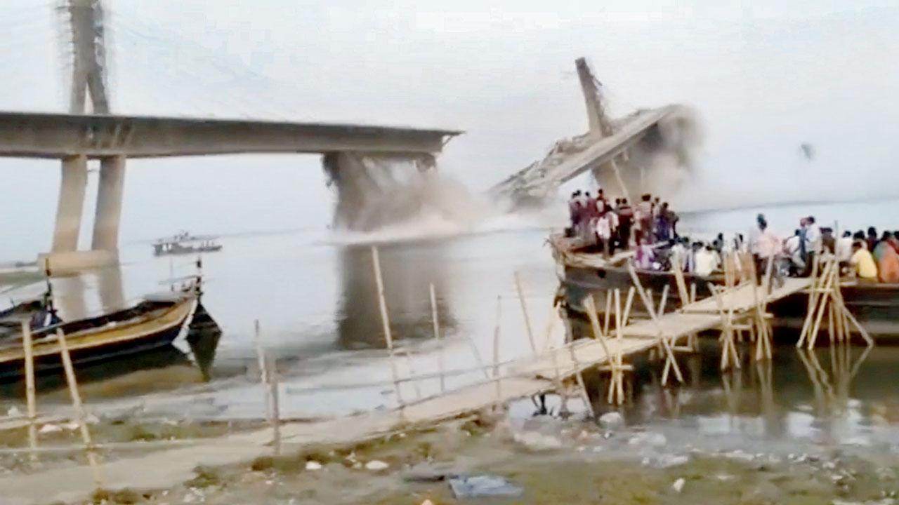 A video grab of the under-construction bridge collapsing in Bihar on Sunday. This was the second time it collapsed during construction. Pic/PTI