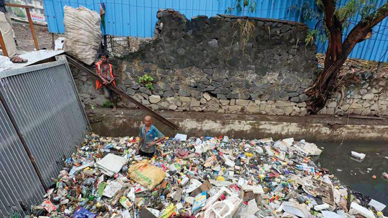 Garbage floating in Mogra nullah near Andheri subway on Saturday