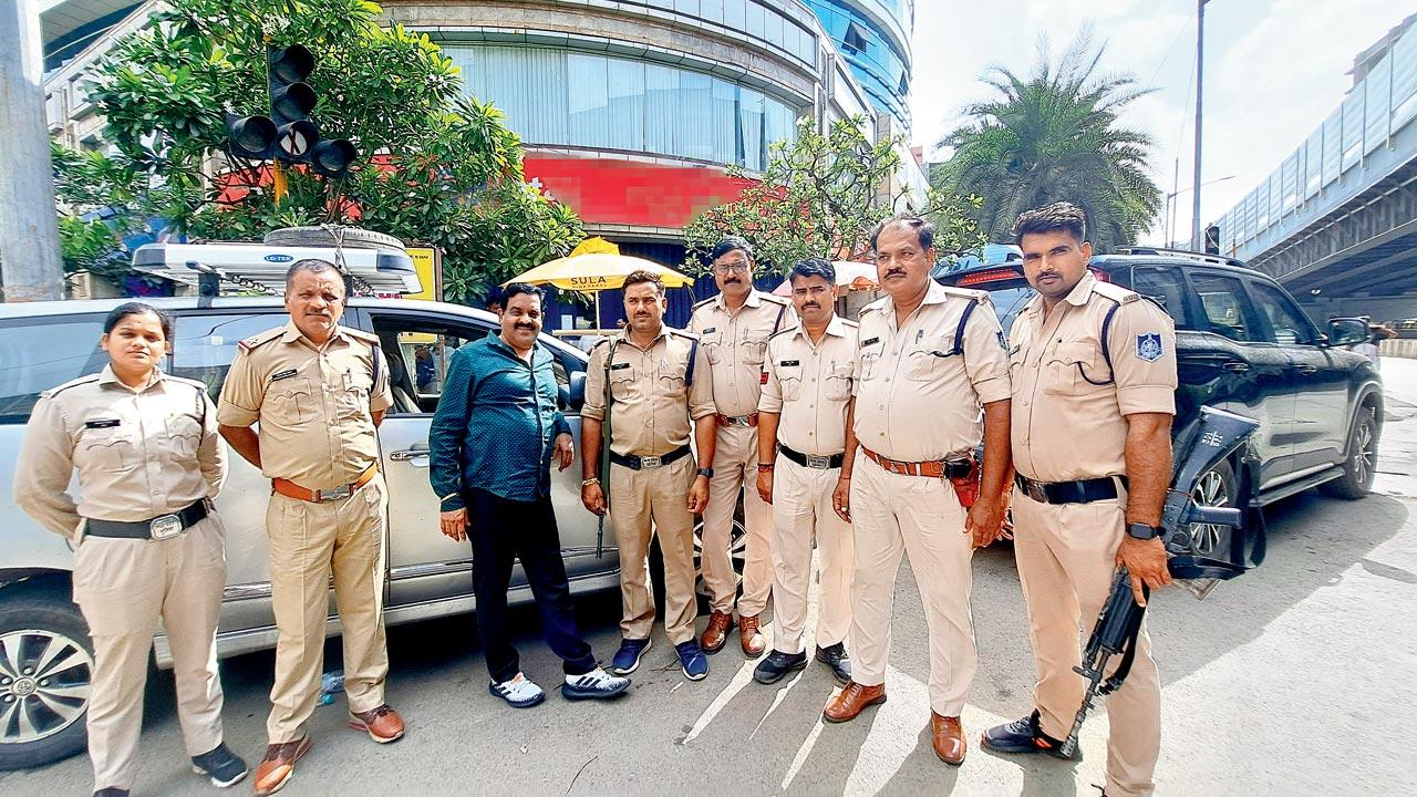 MP police outside the branch of a reputed bank at Andheri East where they went to probe accused Ashish Mehta’s account. Pic/Samiullah Khan