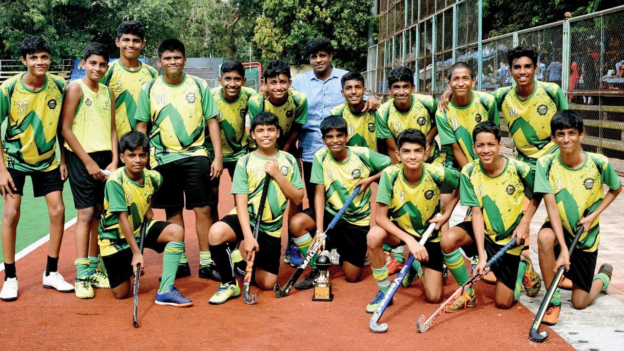 St Stanislaus boys under-16 hockey teams are all smiles with their trophies at the MHAL Stadium in Churchgate recently