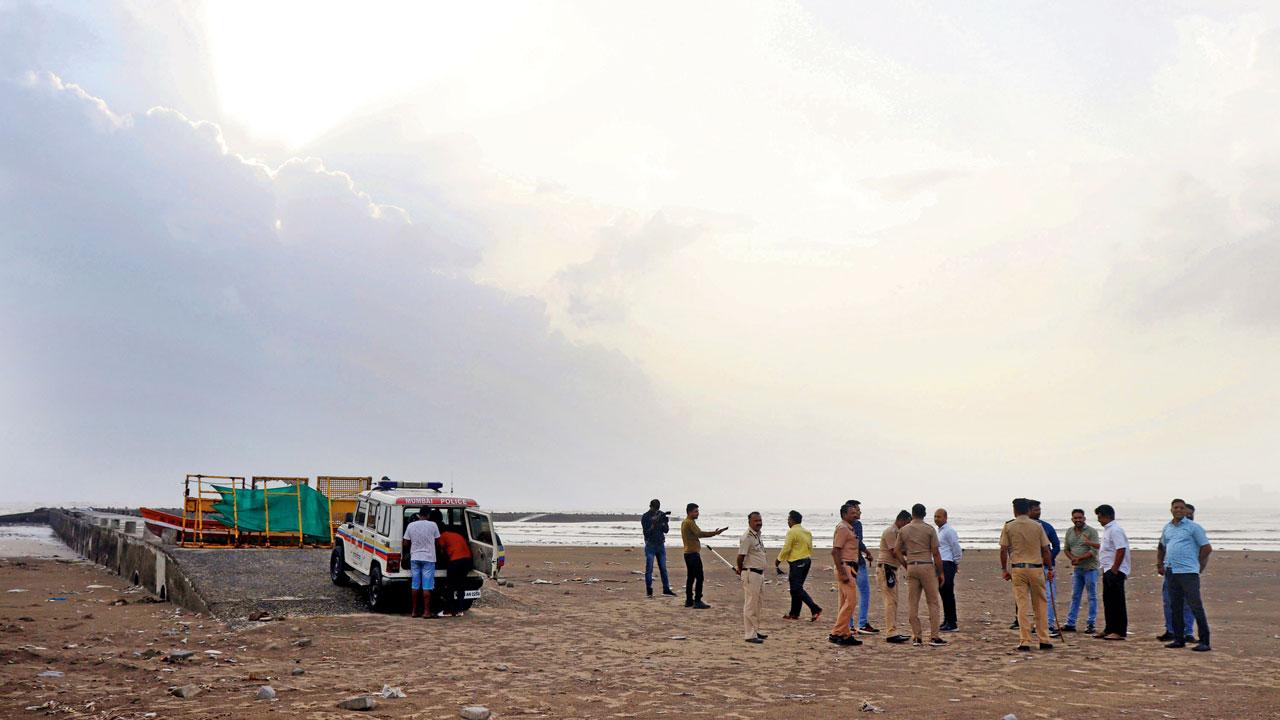 Fire brigade and cops on the beach at Juhu Koliwada. The bodies of the four boys were recovered on Tuesday. Pic/Anurag Ahire
