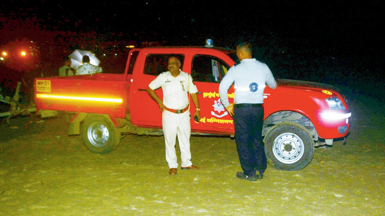 Cops and an ambulance at the Juhu beach on Monday. Pic/Satej Shinde