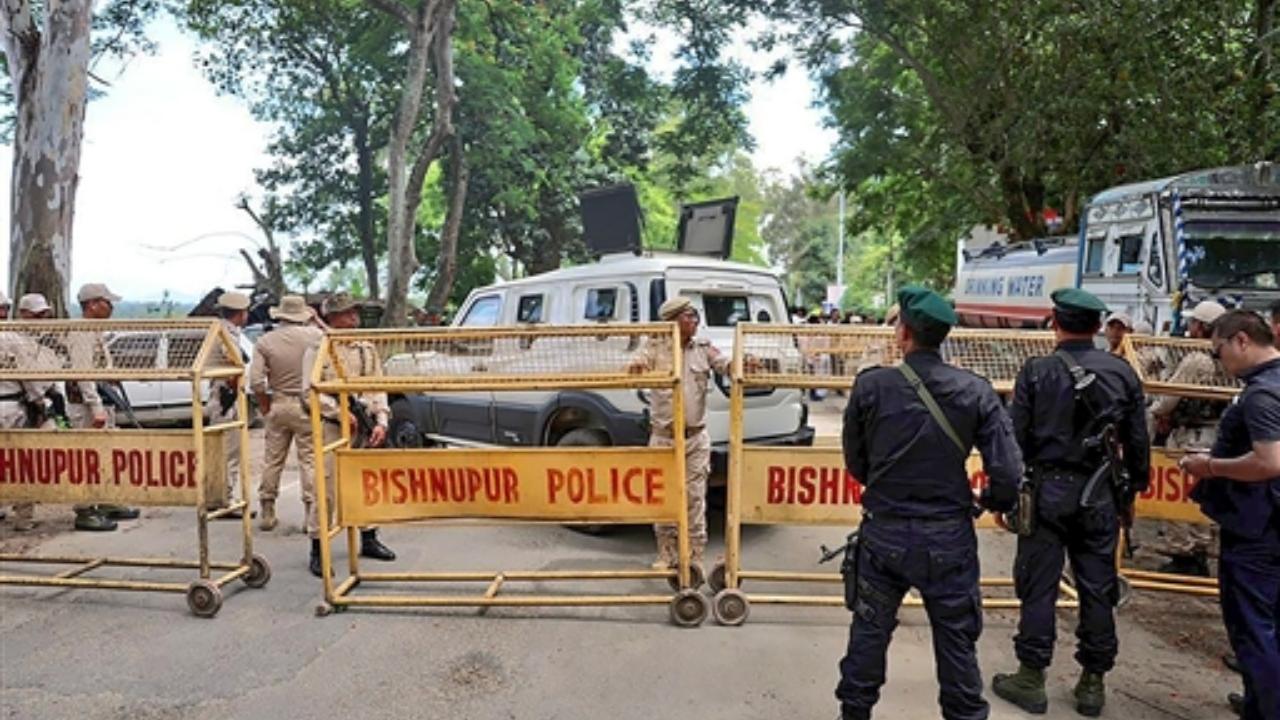 Manipur Police personnel stand guard as Congress leader Rahul Gandhi's convoy was stopped from travelling further, in Bishnupur district
 
