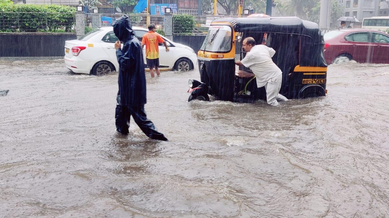 With the level of lakes supplying water to Mumbai going down due to inadequate rainfall in their catchment areas, the city civic body has decided to impose a 10 per cent water cut here starting from Saturday
In Pic: Heavy rainfall in Borivali area (Pic/Nimesh Dave)
 