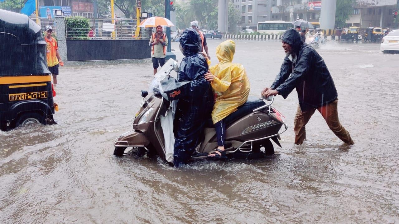 IN PHOTOS: Mumbai witnesses heavy rains, IMD issues orange alert