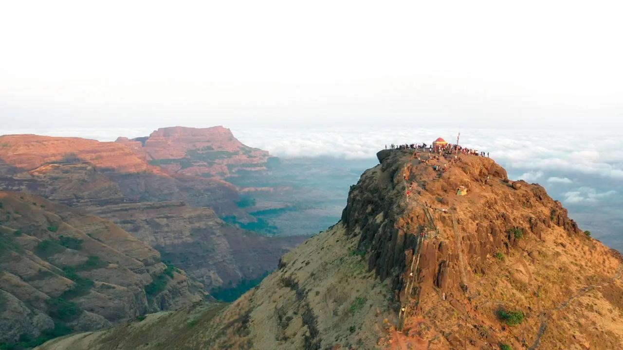The Kalsubai trek is of moderate difficulty level and takes you to the summit of Maharashtra’s highest peak (1,646 meters) and also offers breathtaking views of the surrounding landscape, including the Harishchandragad Wildlife Sanctuary and the Bhandardara dam. To ensure the safety of trekkers, three large ladders have been installed along the trail, making the climb more secure and accessible. The ascent typically takes around four hours, and the descent follows a similar time frame. It takes eight hours to complete the trek