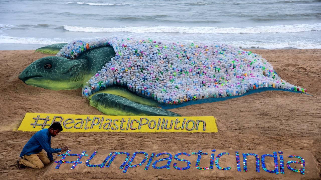 Sand artist Sudarshan Pattanaik creates a sand sculpture also using more than 2000 plastic bottles on the eve of World Environment Day, in Puri, Sunday, June 4, 2023. Pic/PTI