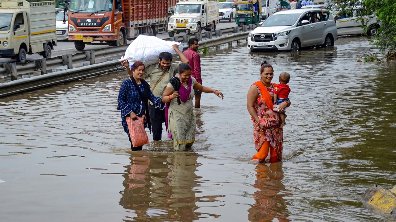 Social media videos highlight the extent of waterlogging in Gurugram as locals struggle to make their way through the rainwater.