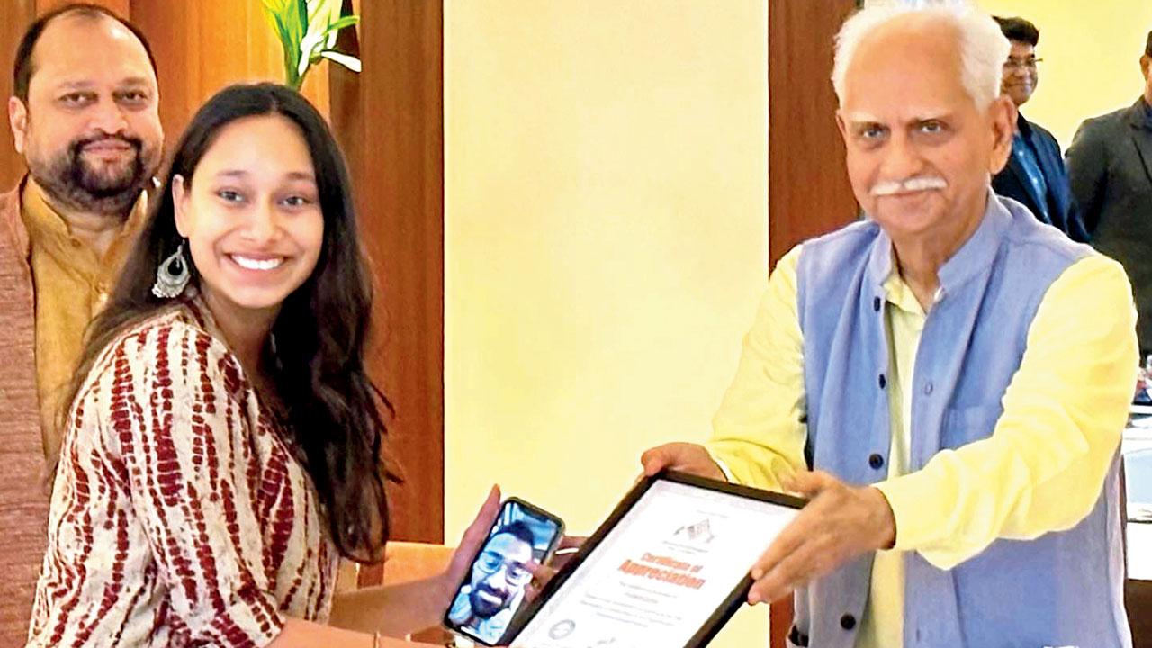 Co-founder Anwar Khan on video call while Anannya Nautiyal (left) accepts the certificate from Ramesh Sippy