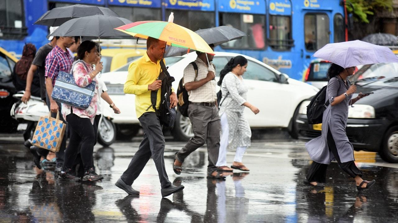 Rains continue in Mumbai; road traffic hit due to waterlogging at some places, local trains slow down