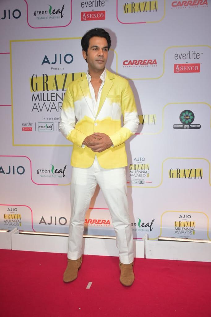 Rajkummar Rao made a stylish statement as he appeared in a white shirt and pants ensemble, accentuated by a vibrant dyed ombré patterned blazer.