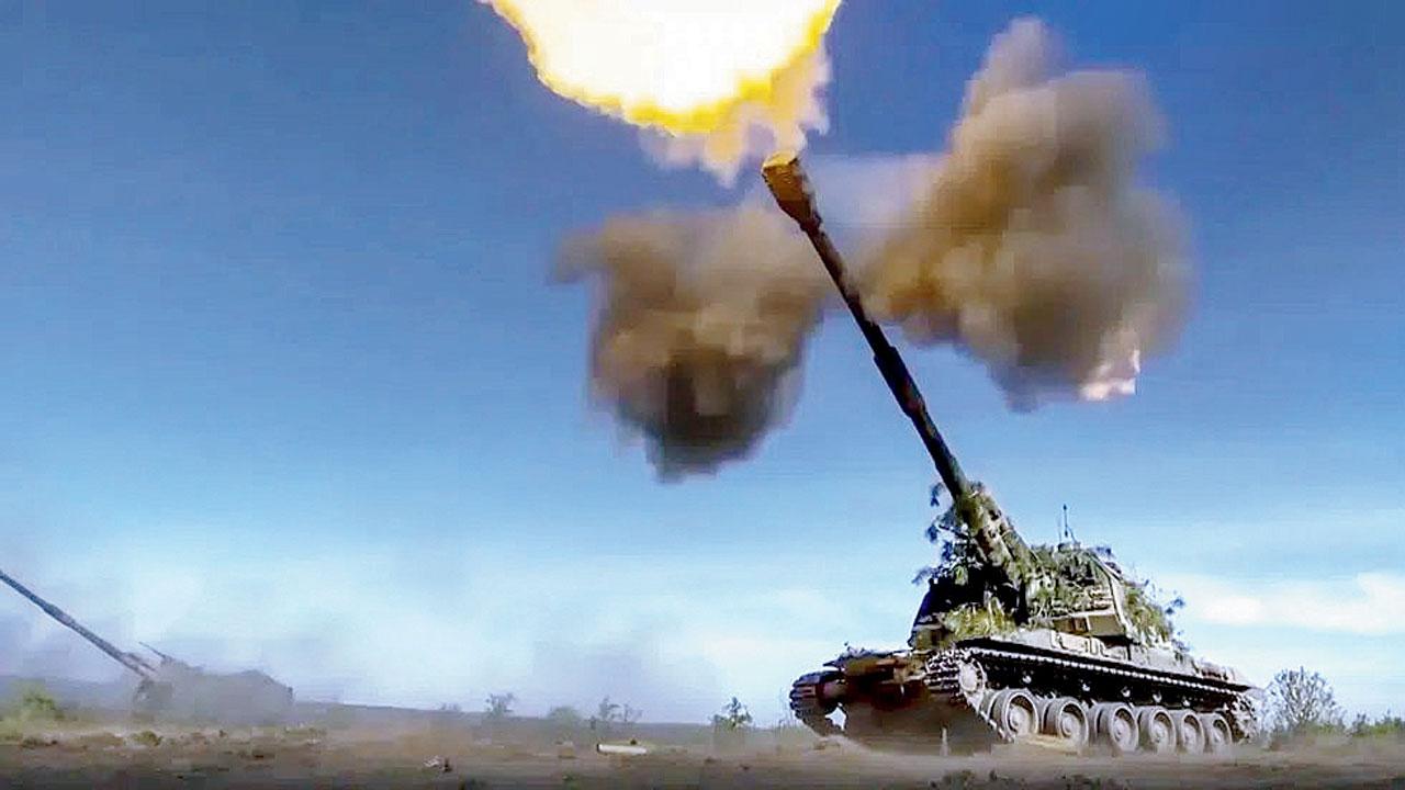A Russian self-propelled gun fires at Ukrainian posts. Pic/AP