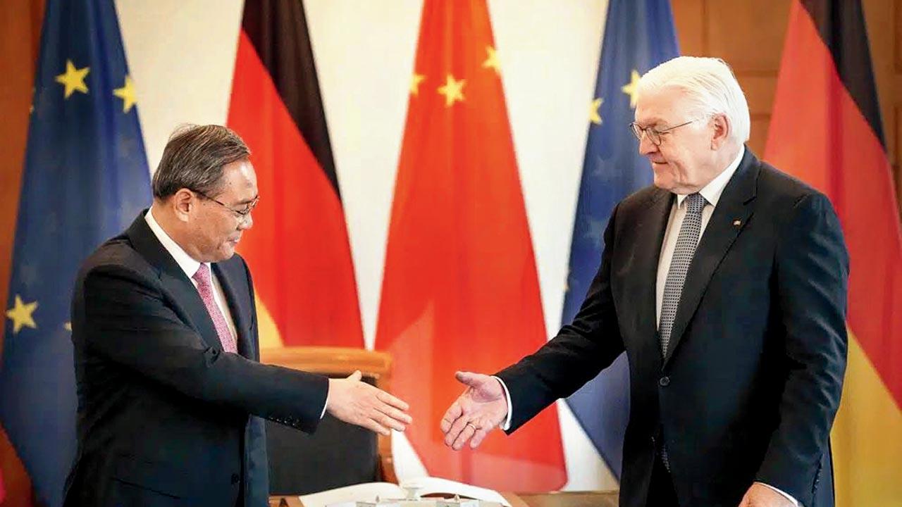 German’s Frank-Walter Steinmeier with Li Qiang. Pic/AP