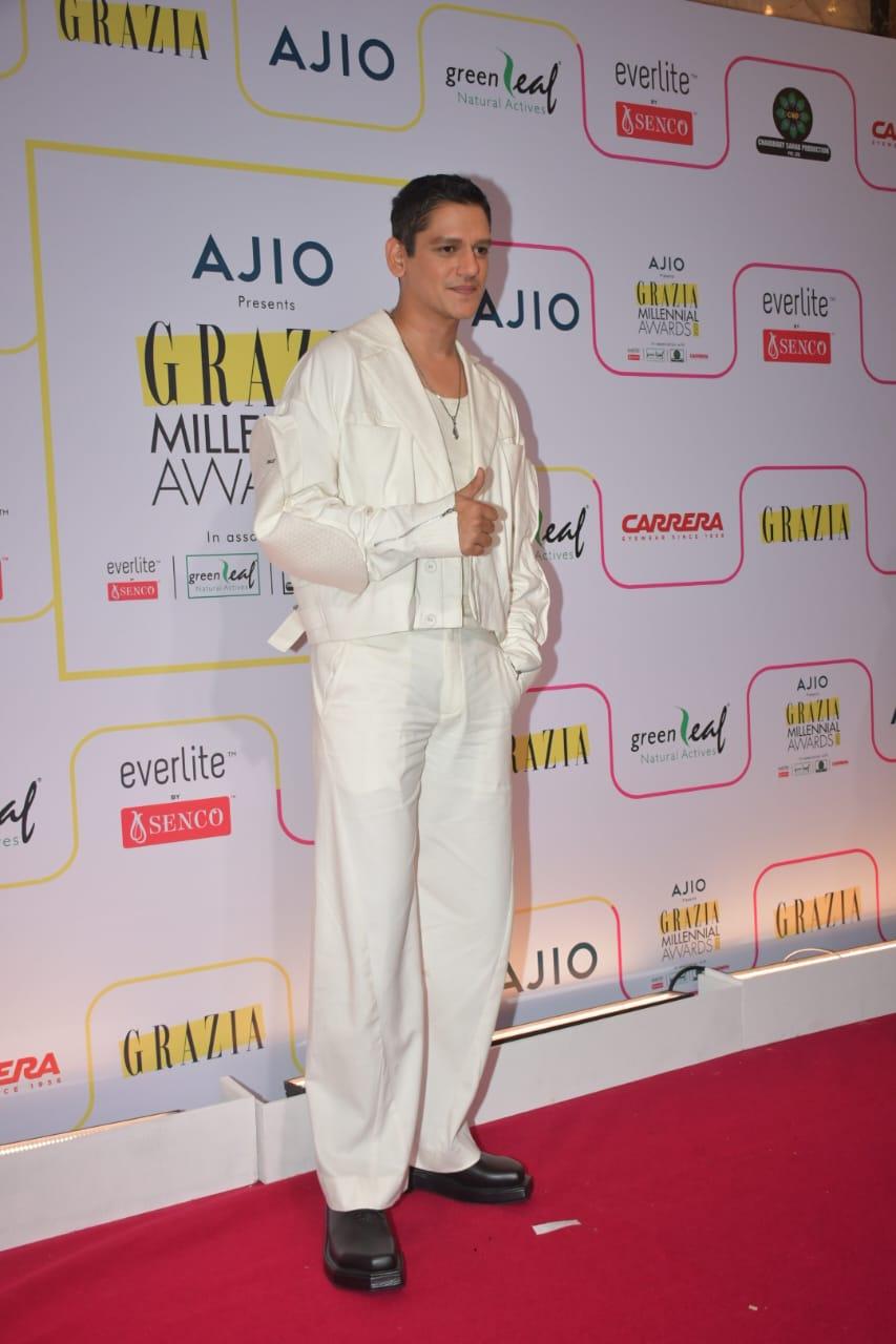 Vijay Varma, the epitome of suave and sophistication, made a striking statement as he set out in an all-white ensemble at the event. 