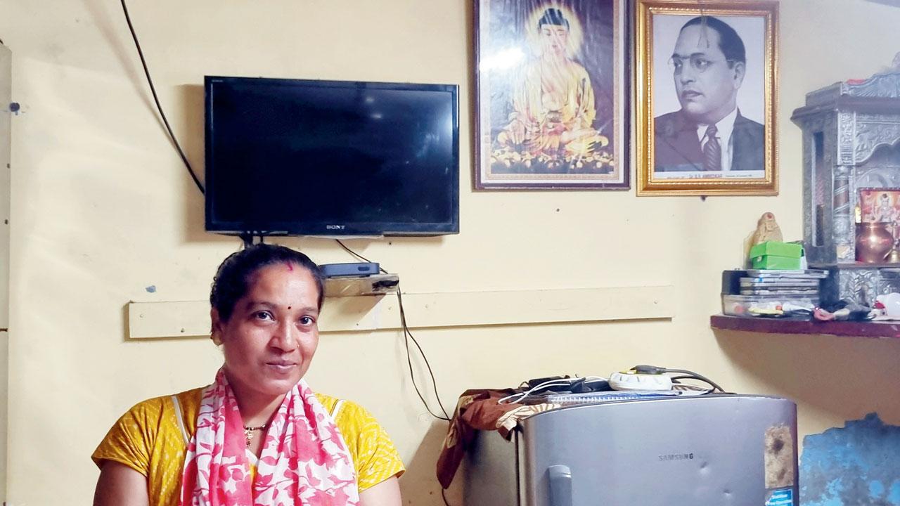 Archana Jamne, a single mother who works as a security person at a construction firm, at her house