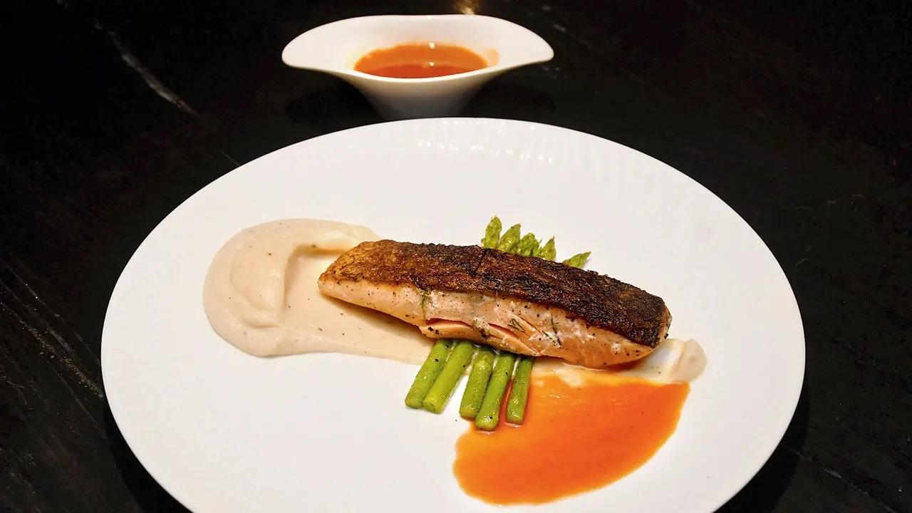 The classic Salmon and Asparagus (Rs 1400) have a decadent celeriac cream. A drizzle of homemade tomato sauce cuts the cream sauce. The meal ends with a Chocolate Duo (Rs 450), which has a chocolate croquette, white chocolate curd and comforting hazelnut ice cream. Additionally, the churros spiral (Rs 400) stands out for it tastes like a mix between a churro and a cinnamon bun. In Photo: Salmon and asparagus
Napoli by ShatranjTime: 8 pm onwards; dinner seating only on weekdays. On weekends, dinner and lunch seating from 12 noon onwardsAt: 12, Union Park Pali Hill, near Petit Girls High School, Khar West.Call: 7977616345, 7400396373