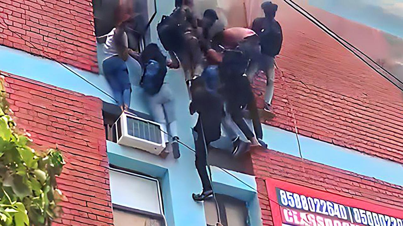 In a video shared by the fire department, people, mostly students, can be seen rescued by the firemen through windows. The video shows trapped students coming out of the top floor of the building one by one. Some of them are also seen throwing their bags and helping one another during the rescue operation
